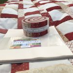 quilt con telas recortadas jelly roll y layer cake